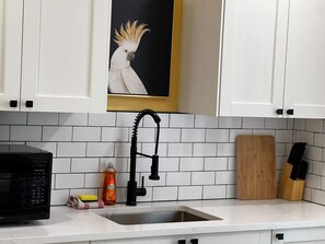 This kitchen is fully equipped and full of charm.