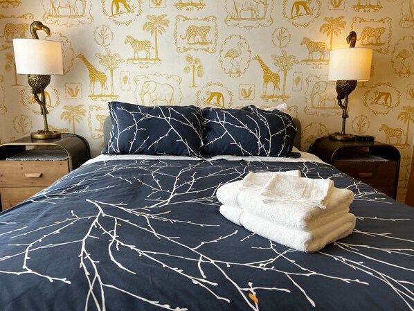 Sleep like a king of the jungle in this vibrant, animal-inspired bedroom with a cozy queen bed.