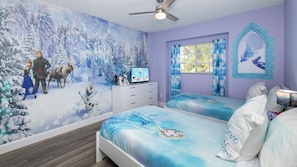 Let it go in this 2nd-floor bedroom, with a pair of twin beds & Smart TV