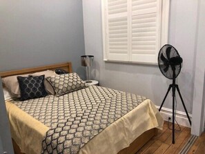 Queen-sized Bed & Pedestal Fan