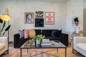 Bright and open living space complete with designer furnishings and smart TV.
