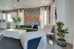 Bright and open living space complete with designer furnishings and smart TV.