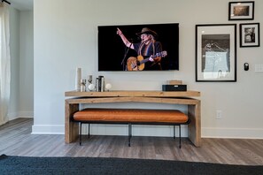 Bright and open living space complete with designer furnishings and smart TV.
