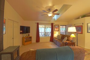 Room darkening curtains make it easier to watch tv.