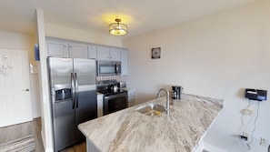 "Sink","Sink Faucet","Indoors","Kitchen","Refrigerator"