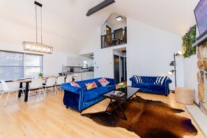 Furniture, Indoors, Living Room, Floor, Flooring