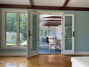 Sunroom with game table and sleep sofa