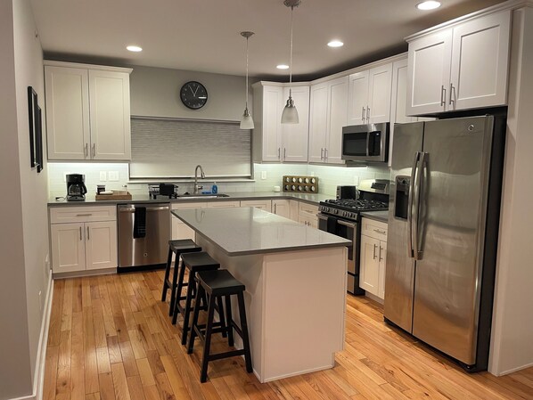Gorgeous, spacious chef's kitchen with large kitchen island