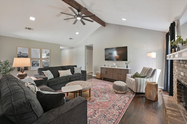 Living Room with 65" TV and Queen Sleeper Sofa