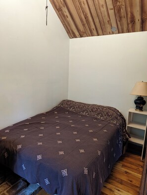 Double Bed in extension off Living Room. Sliding door for privay