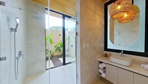 Main bedroom, private bathroom and outdoor shower