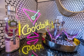 This cocktail bar setup exudes a trendy and lively vibe, perfect for crafting your favorite drinks.