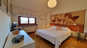 Bedroom with magnificent painting in the center of Viareggio.