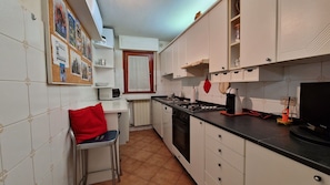 Cozy and fully equipped kitchen, part of a large apartment close to the sea.