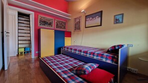 Room with two single beds suitable for families with children.