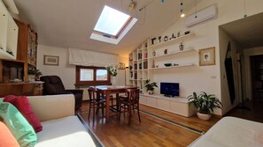 Bright living room decorated in wood and marble.
