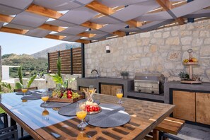 Savor alfresco dining under this beautiful shaded area!