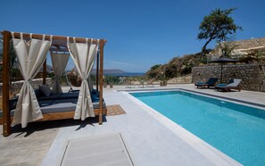 The pool terrace features six sun beds, three umbrellas and two gazebos!