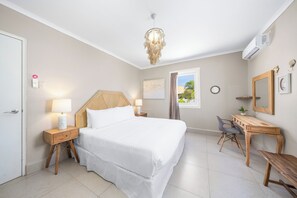 Experience luxurious comfort in our exquisite bedroom of the home in Oranjestad, Aruba - Enjoy the spacious and inviting atmosphere with a cozy double bed for restful night sleep - The elegant décor combines classic and contemporary elements