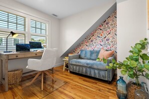 This home includes a remote workspace and a single pull out bed