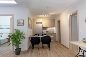 Dining area and fully equipped kitchen.