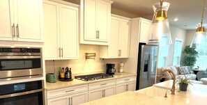 Kitchen with Stainless Steel Appliances and Home-Cooking Condiments