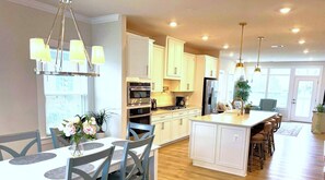 First Floor Open Design:  Dining Room; Spacious Kitchen, and Living Room