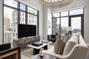 Living room featuring a 65" 4K UHD TV