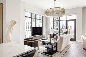 Living room featuring a 65" 4K UHD TV