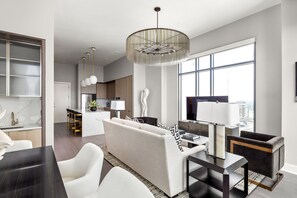 Living room featuring a 65" 4K UHD TV