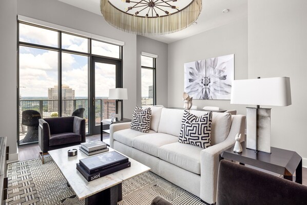 Living room featuring a 65" 4K UHD TV