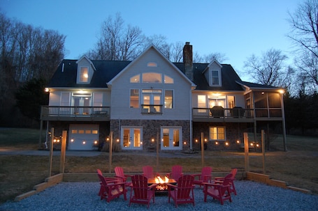 Huge firepit area with Edison lights for you and your guests to enjoy together.