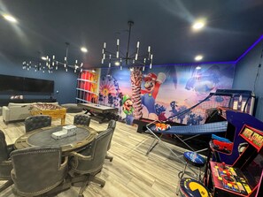 High-energy indoor game room with arcade classics, perfect for entertainment at any age.