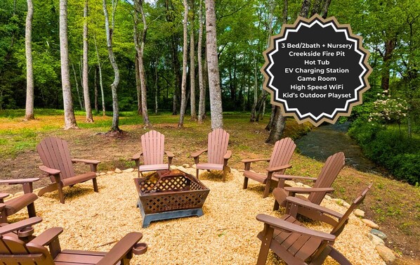 Relax around the 9-Seat Fire Pit by the Private Creek nestled among the shade trees while the kids play nearby 