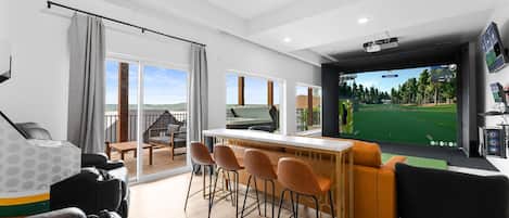 LUX GOLF LODGE by Great Escapes Homes is the ultimate golfer's getaway! Full golf simulator + Golden Tee + 9BR/9Ba for the whole crew to come enjoy.
