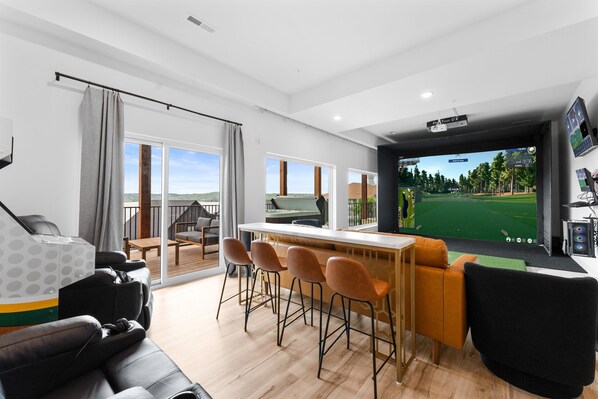 LUX GOLF LODGE by Great Escapes Homes is the ultimate golfer's getaway! Full golf simulator + Golden Tee + 9BR/9Ba for the whole crew to come enjoy.