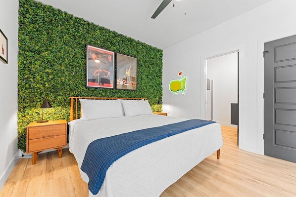 Golf-themed king bedroom with ensuite bathroom—comfort and style for golf lovers.