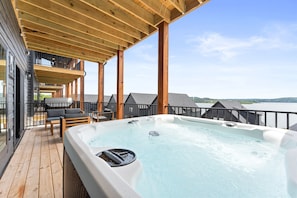 Relax on the deck with stunning lake views while enjoying the private hot tub or barrel sauna.