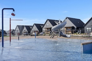 Soak up the sun and splash the day away in the outdoor pool, complete with a slide and splash pad!