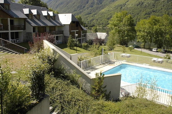 Surrounded by trees and greenery, this is the perfect summertime escape.