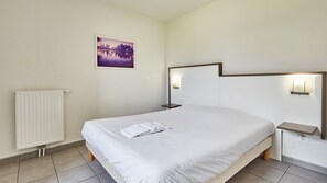 Relax on the comfy bed after a day outside.