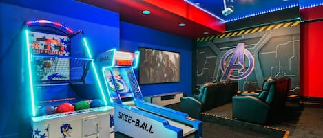 Epic Avengers-themed theater with skee-ball, basketball, and movie night magic.