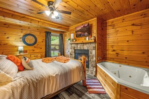 Cozy bedroom with fireplace and indoor jacuzzi—your perfect retreat!