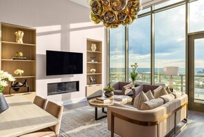 Living room featuring a 65" 4K UHD TV