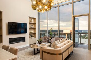 Living room featuring a 65" 4K UHD TV