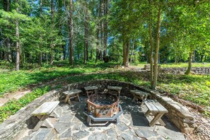 Wood-burning fire pit on the original stonework patio