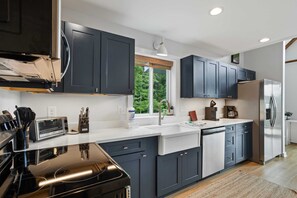 Kitchen with Stainless Steel Appliances and Quartz Countertops