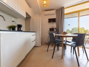 Furniture, Interior Design, Wood, Flooring, Floor, Countertop, Lighting, Ceiling, Room, Kitchen