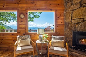 The living room has a beautiful stone - wood burning fireplace, that makes for the most cozy evenings while you play games with your family