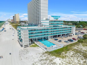 Beachfront condo with pool, perfect for a relaxing getaway.